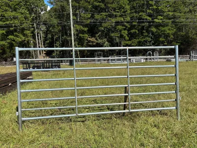 Galvanized 6x12 heavy corral panel standing in a pasture