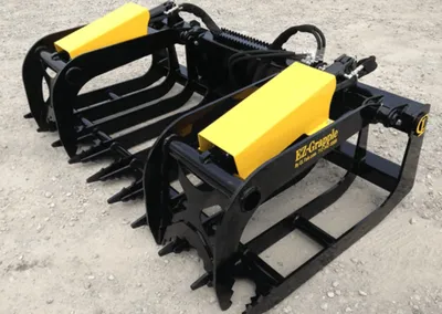 Pair of CL Fabrication EZ Grapple root grapples with yellow cylinder guards
