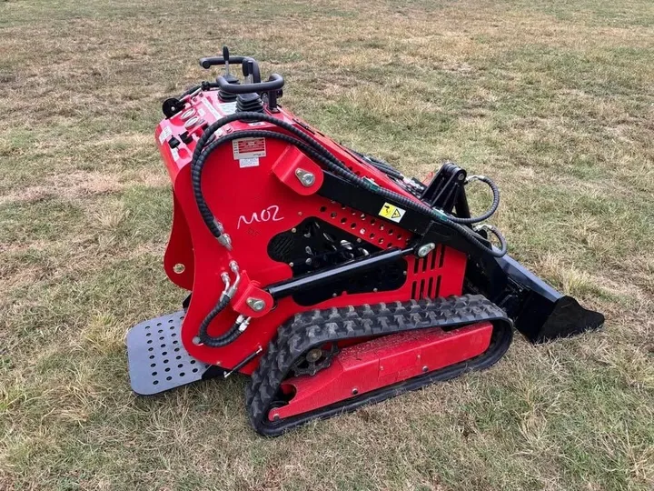 SSL60 mini skid steer with the bucket raised, angled view