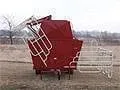 155 bushel commercial creep feeder with panels folded up for transport