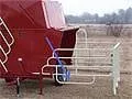 Creep feeder feed trough and adjustable panel