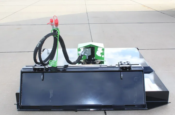 DPM Brush Buster rear view showing the quick-attach plate and hydraulic couplers