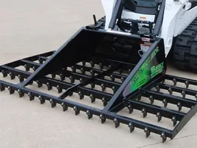 B-Built Rake-N-Ator on a Bobcat track loader