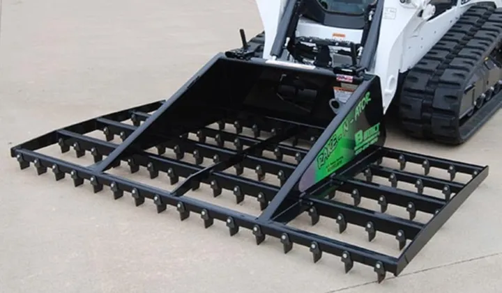 94-inch Rake-N-Ator on a Bobcat track loader, angled view